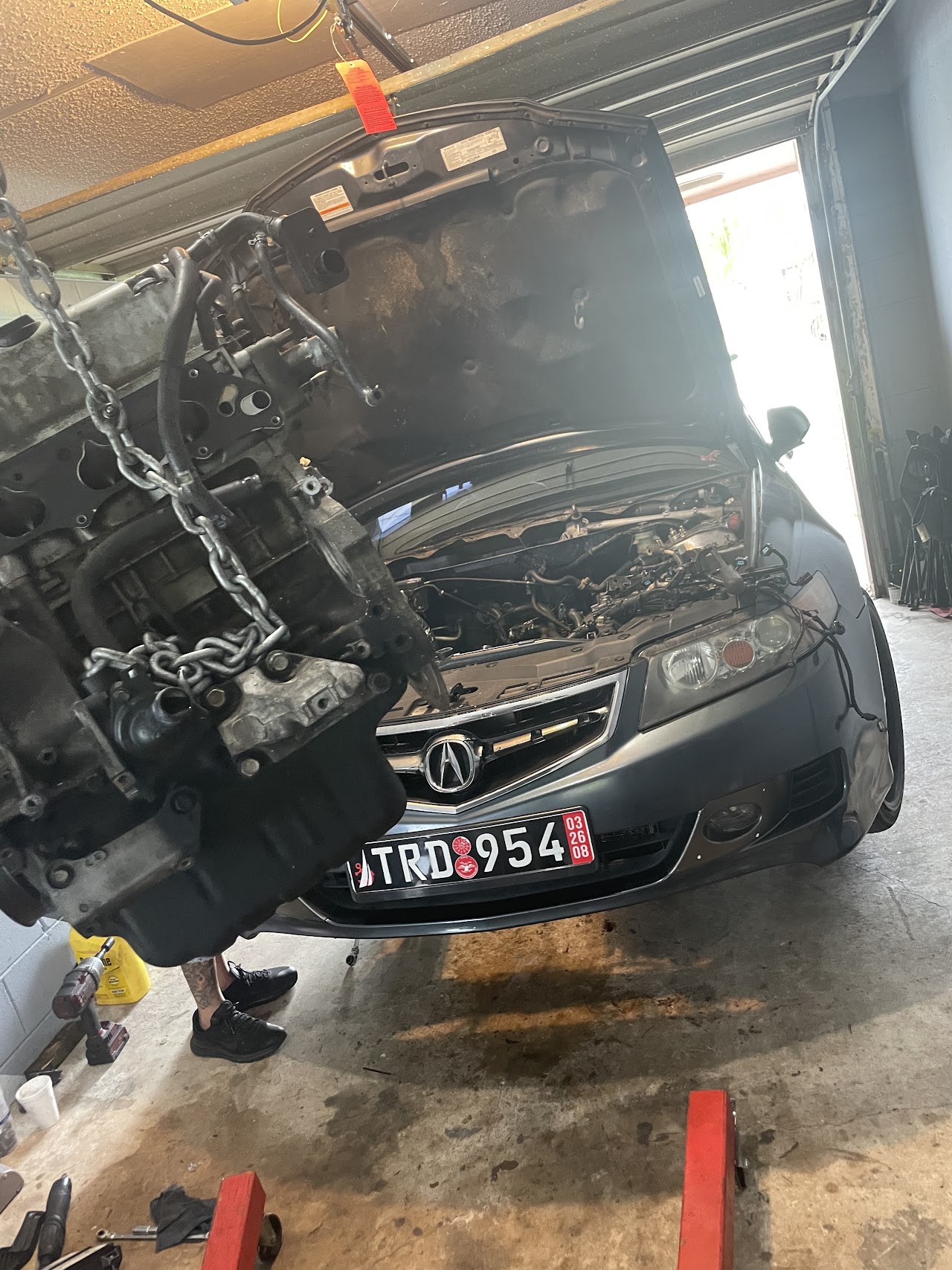 Mechanic working on high performance car engine